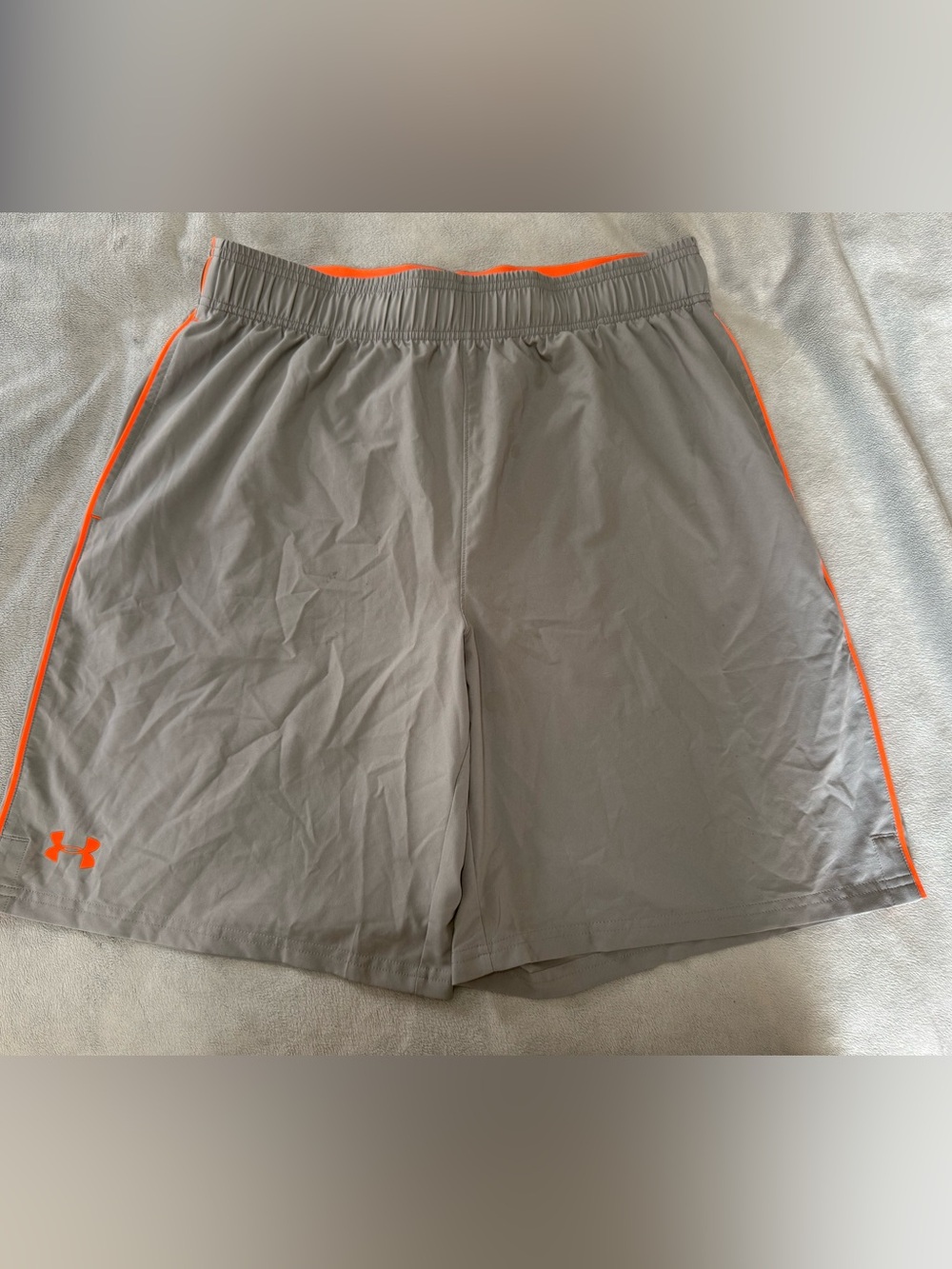 Men’s Under Armour Gray Athletic Shorts with Orange Trim. Size Large